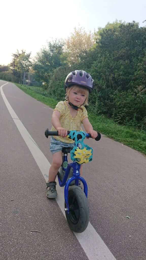 Child with bicycle and bicycle basket